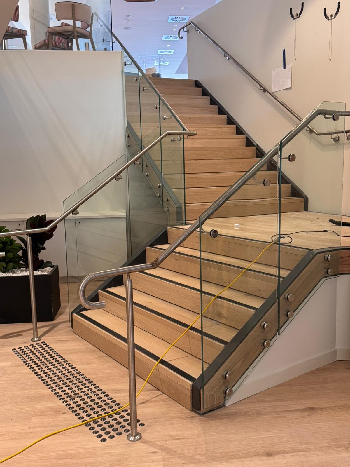Stainless handrail on a glass balustrade, timber stair, Sans Souci