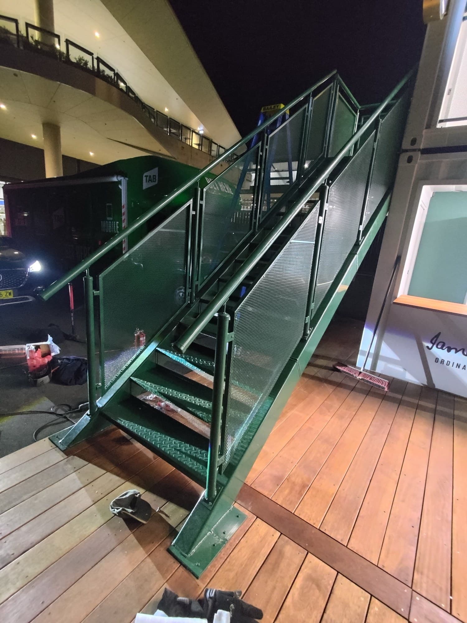 Green steel stair with perforated infill panels, Moore Park